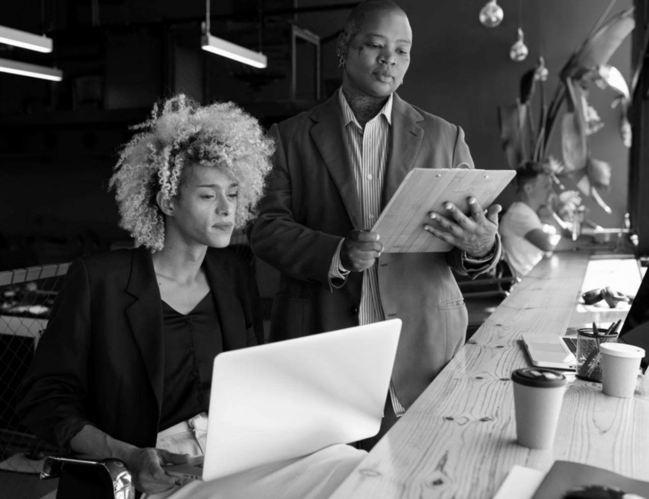 Students reviewing financial charts and investment materials during an interactive workshop session
